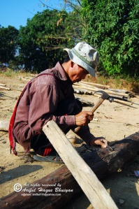 A tribal man was reparing his old home